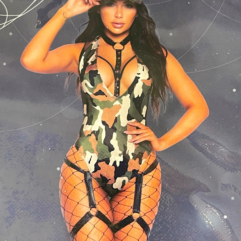 Super sexy one piece Halloween outfit that has leather Garter straps on legs
